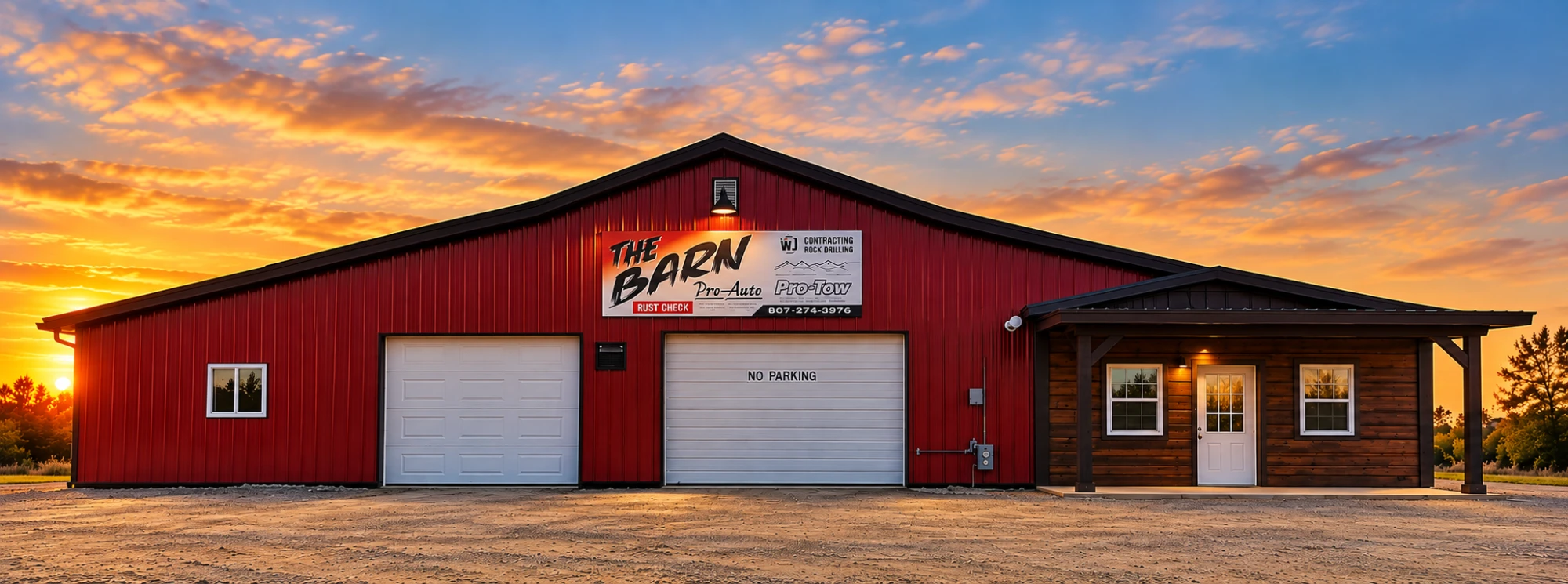 The Barn Automotive - our red tin shop in Fort Frances at sunset