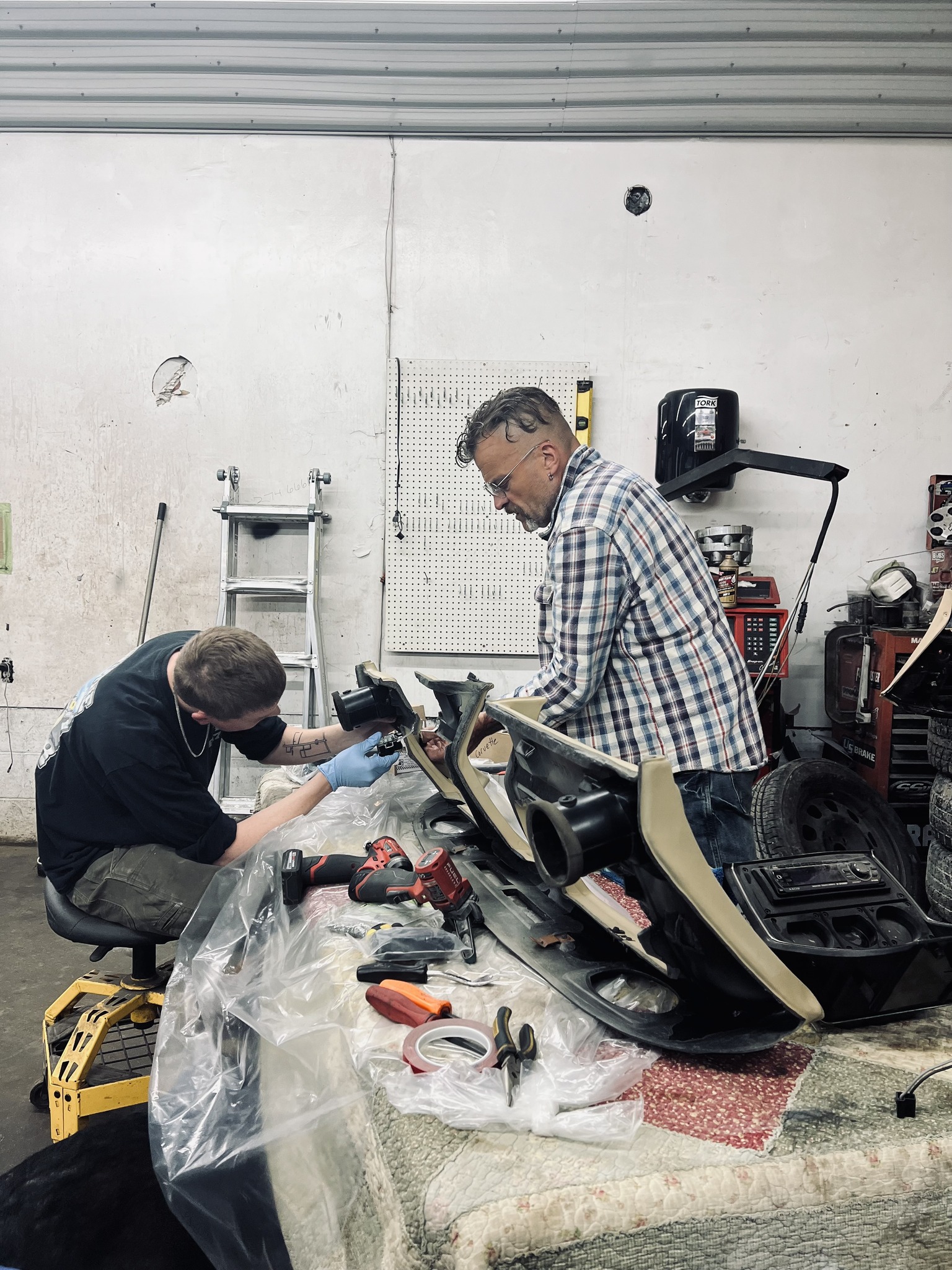 Pro-Shine team restoring a vintage car in the shop